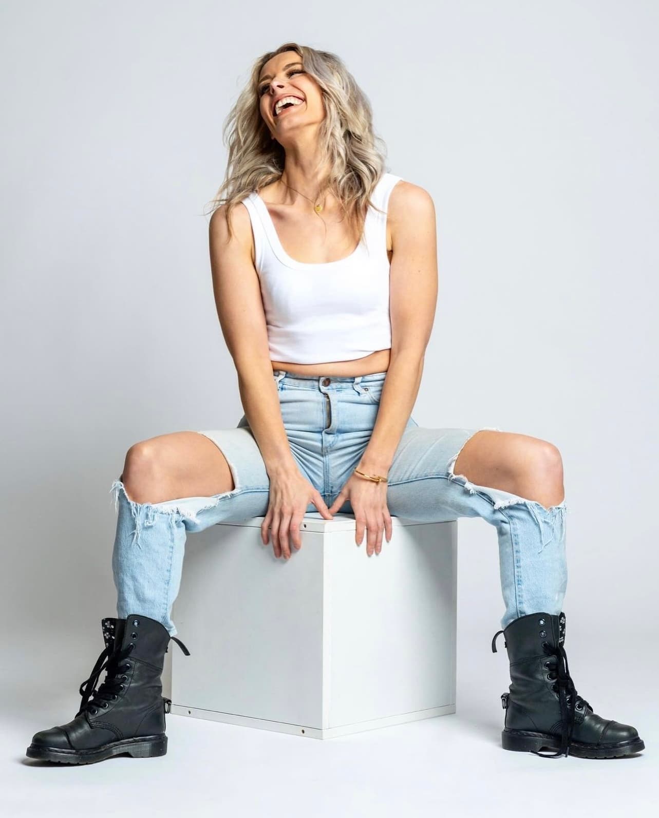 Leah Blomfield seated and laughing